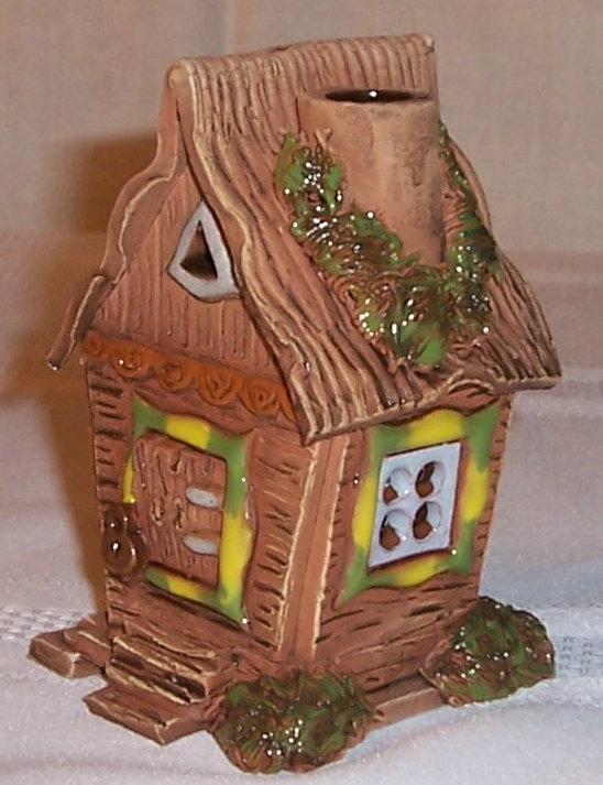 Candle house with angled wall.